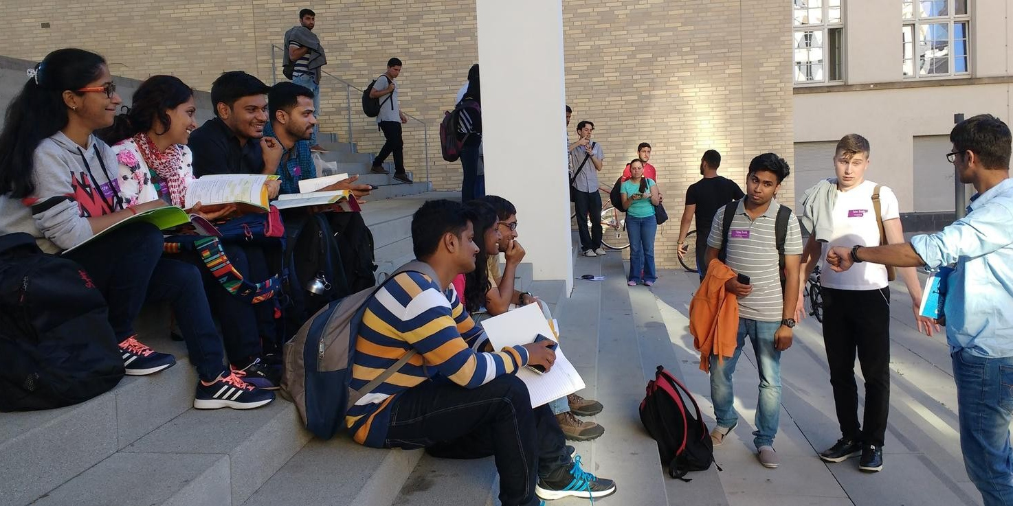 International Students sitting on stairs.