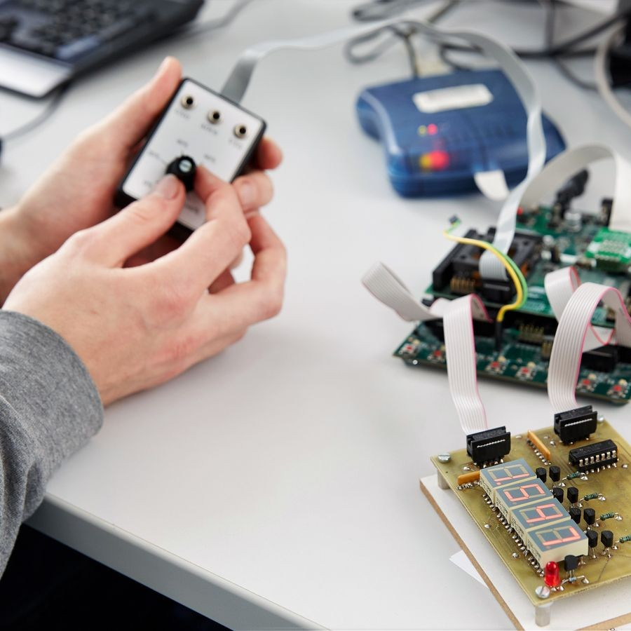 a student tests a microprocessor